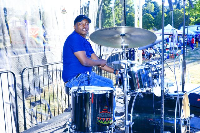 Waweru Uyu behind the drum kit on stage